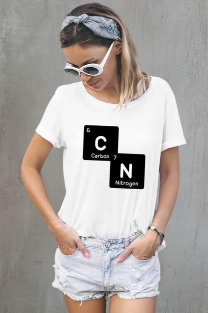 Woman wearing a white t-shirt with a 67 carbon and nitrogen graphic against a gray background