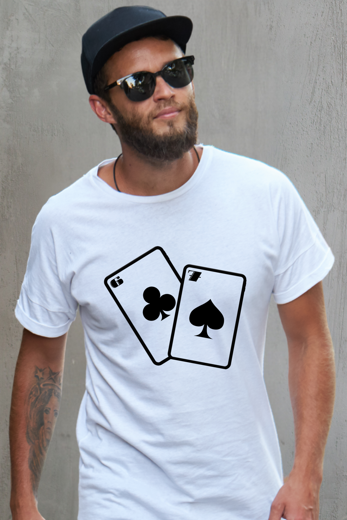 Man wearing a white t-shirt with 67 playing card suits design against a white background
