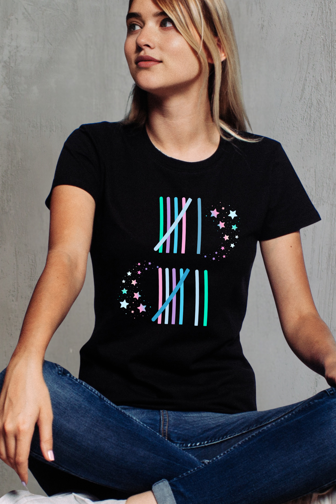 Woman wearing a black t-shirt with 67 colorful geometric design against a gray background