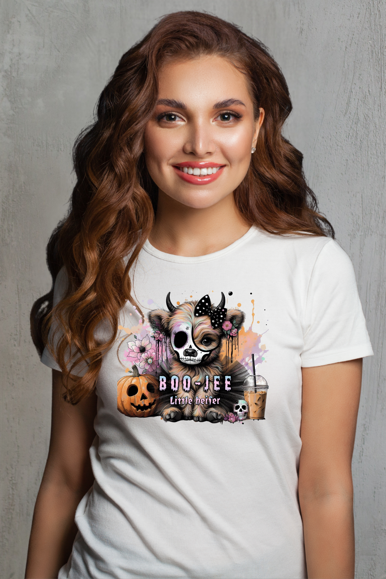 Woman wearing a white t-shirt with a graphic design on a gray background