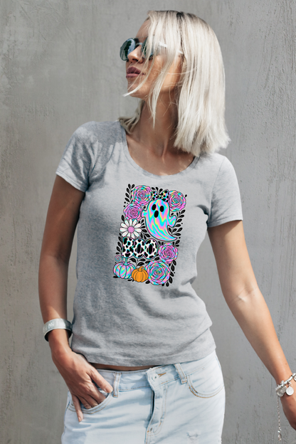 Woman wearing a gray t-shirt with a colorful owl design against a gray background