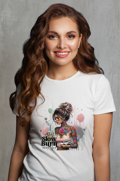 Woman wearing a white t-shirt with a graphic design and text against a gray background