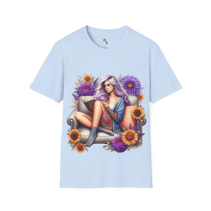 Light blue t-shirt with a colorful graphic of a woman sitting on a couch surrounded by flowers.
