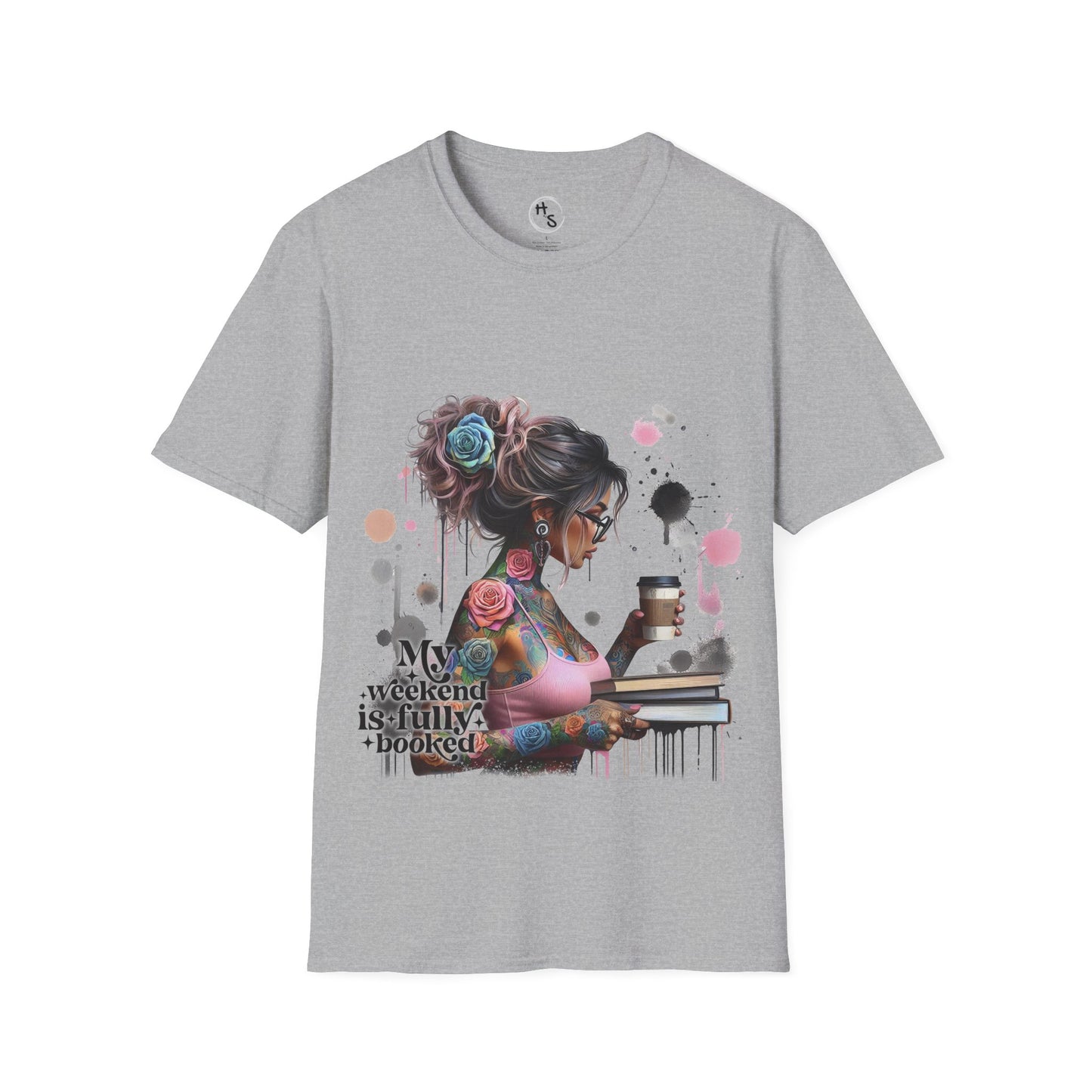 Gray t-shirt with a graphic design of a woman with tattoos and flowers, holding a book and cup, on a grey background.