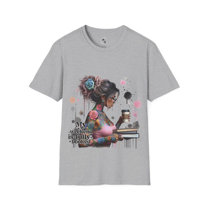 Gray t-shirt with a graphic design of a woman with tattoos and flowers, holding a book and cup, on a grey background.