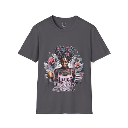 Gray t-shirt with a colorful graphic design featuring a woman, flowers, and text on a white background.