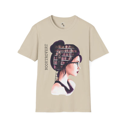Beige t-shirt with a graphic design of a woman with books on her head and 'Bookaroovert' text.