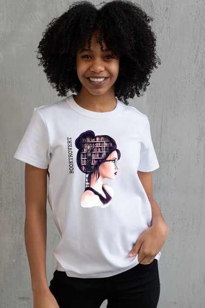 Person wearing a white t-shirt with a graphic design of a woman with books in her hair against a gray background