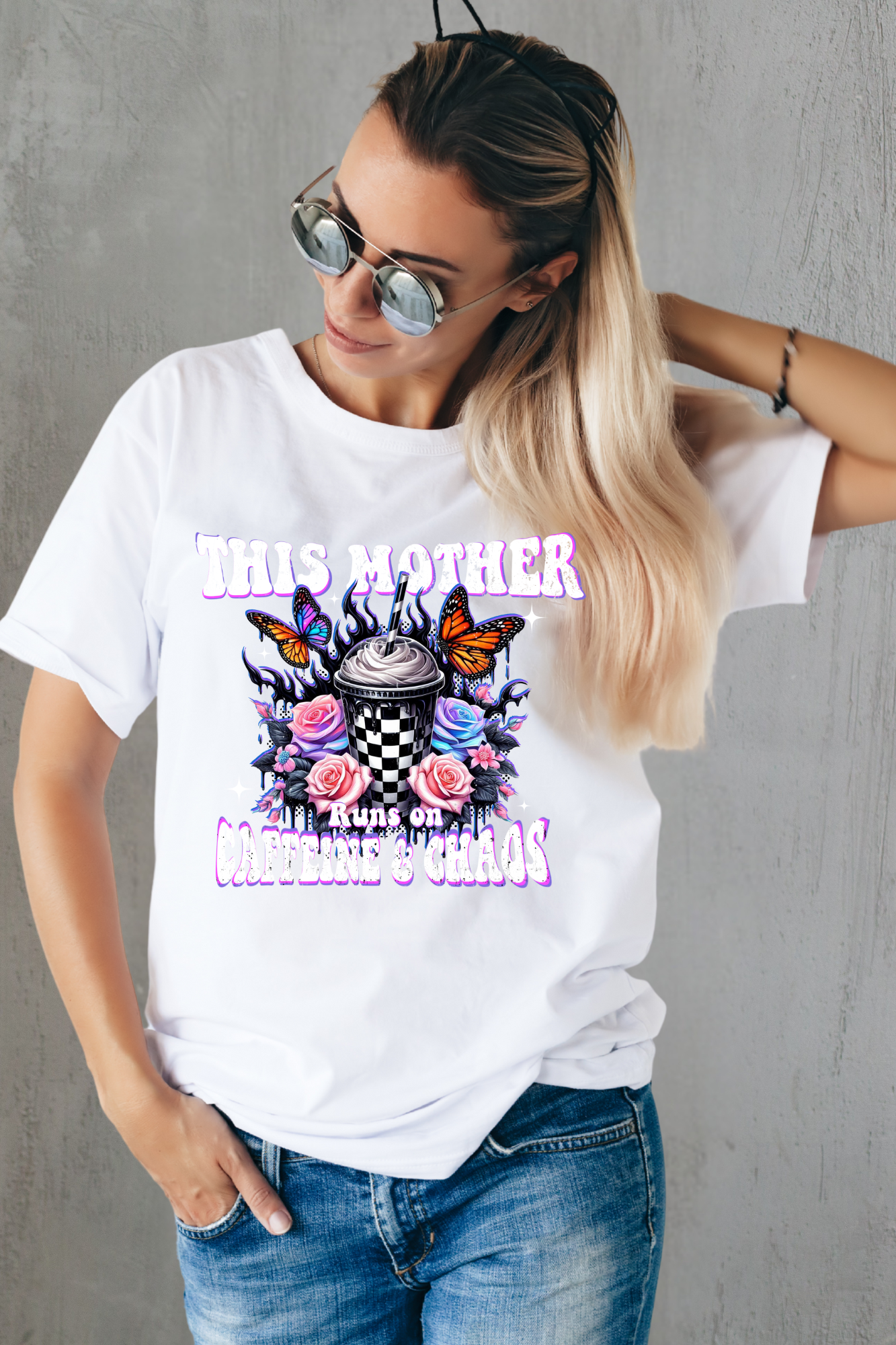 Woman wearing a white t-shirt with colorful graphic design and text.