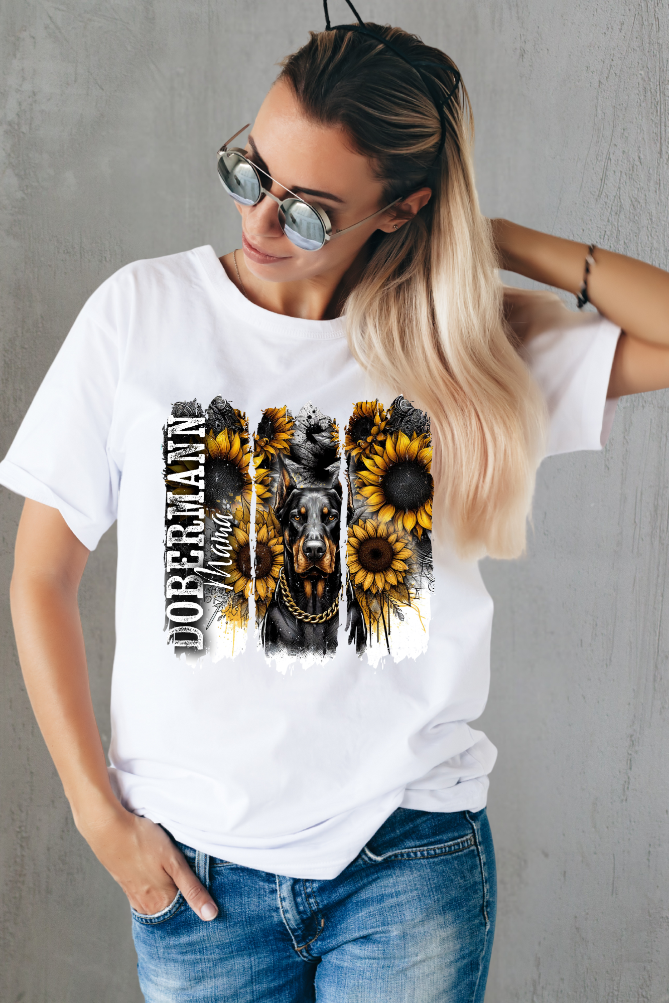 Regal Dobermann Mama T-shirt featuring fierce Dobermann with gold chain surrounded by sunflowers and grunge background, perfect for proud dog moms.