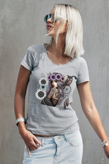 Woman wearing a gray t-shirt with a graphic design against a gray background