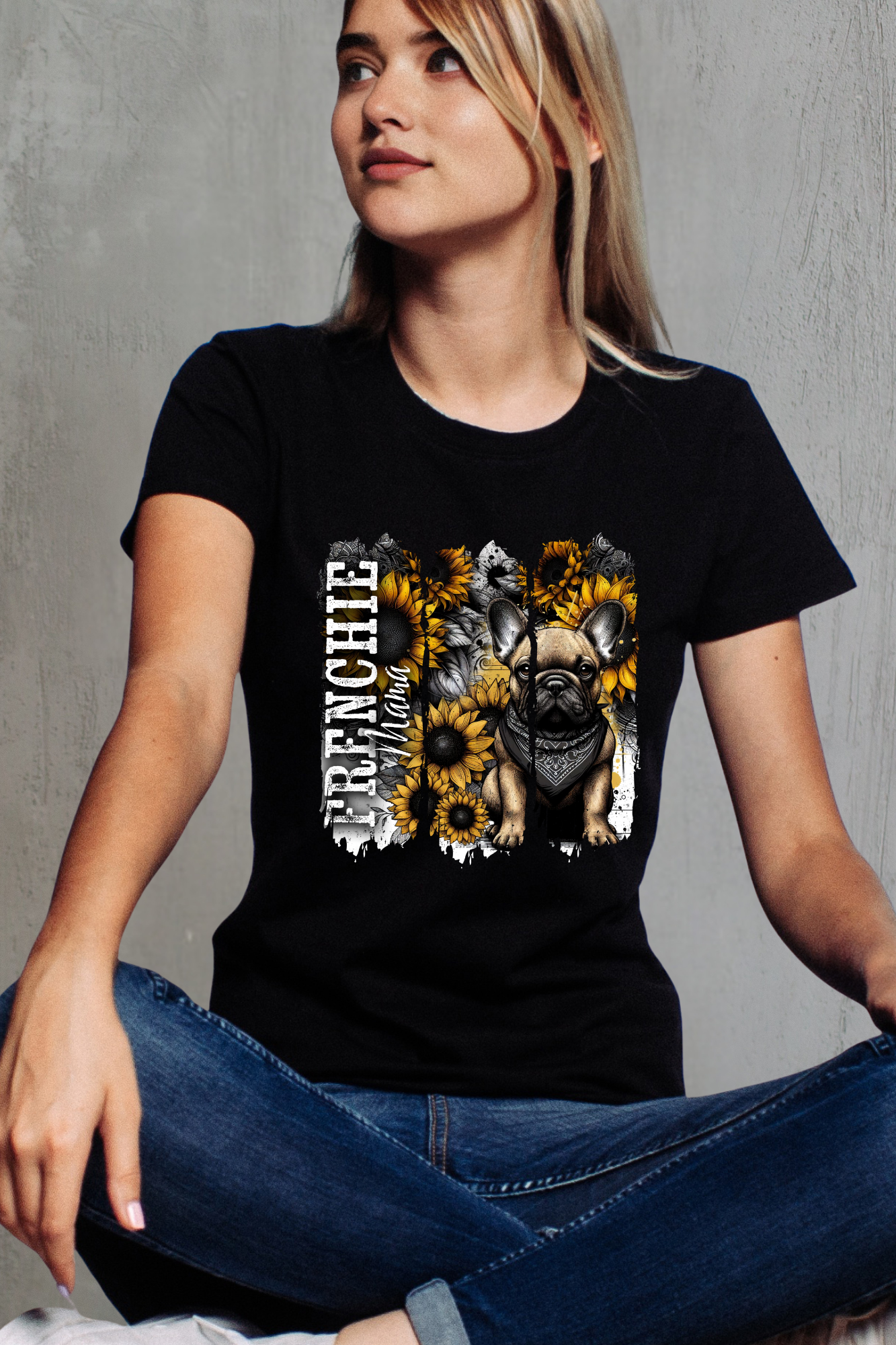 Frenchie Mama black T-shirt featuring a French Bulldog in a bandana surrounded by vibrant sunflowers with bold distressed lettering.