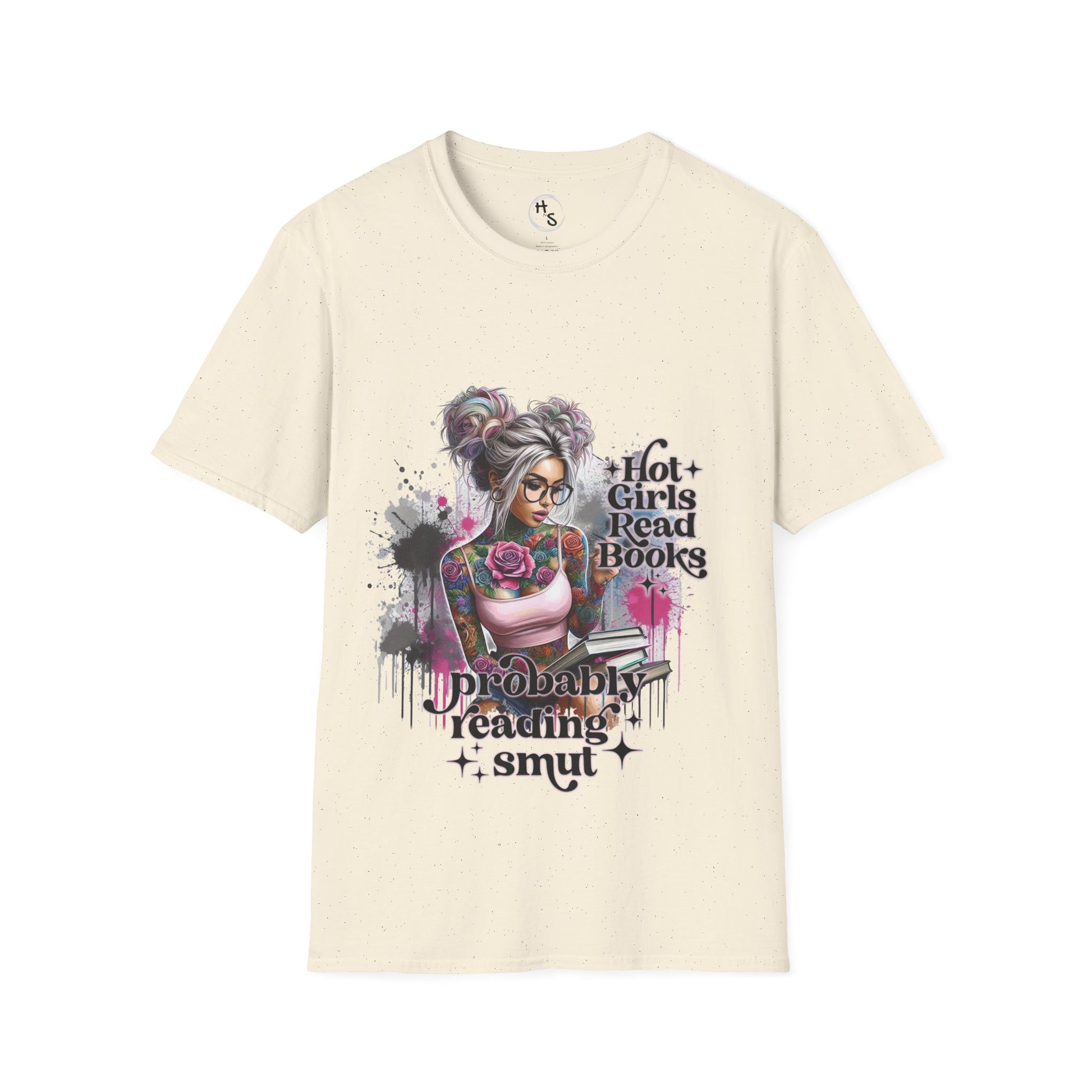 Beige T-shirt with a colorful graphic of a tattooed girl holding books, sitting casually against a gray wall.