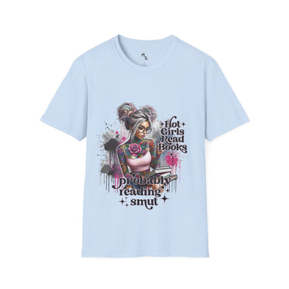  Light blue T-shirt with a colorful graphic of a tattooed girl holding books, sitting casually against a gray wall.