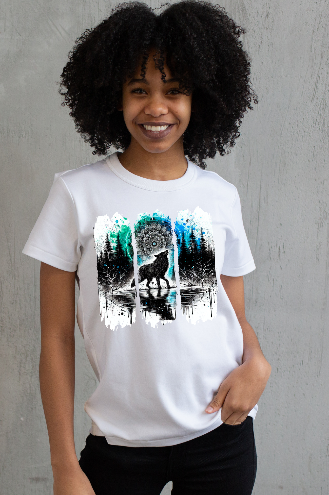 Person wearing a white t-shirt with a graphic design of a wolf and trees.