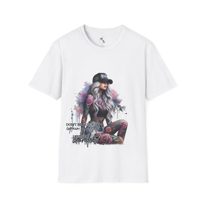 White t-shirt with a graphic design of a woman with tattoos and flowers, on a white background.