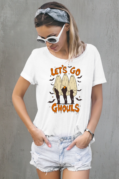 Woman wearing a white t-shirt with 'Let's Go Ghouls' graphic design against a gray background