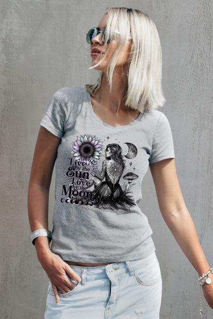 Woman wearing a gray t-shirt with a graphic design against a gray background