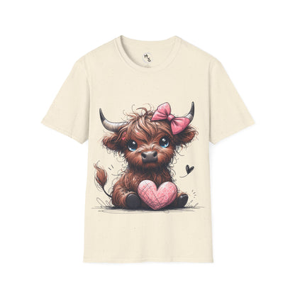 Beige t-shirt with a cartoon cow holding a pink heart and a pink bow on a white background