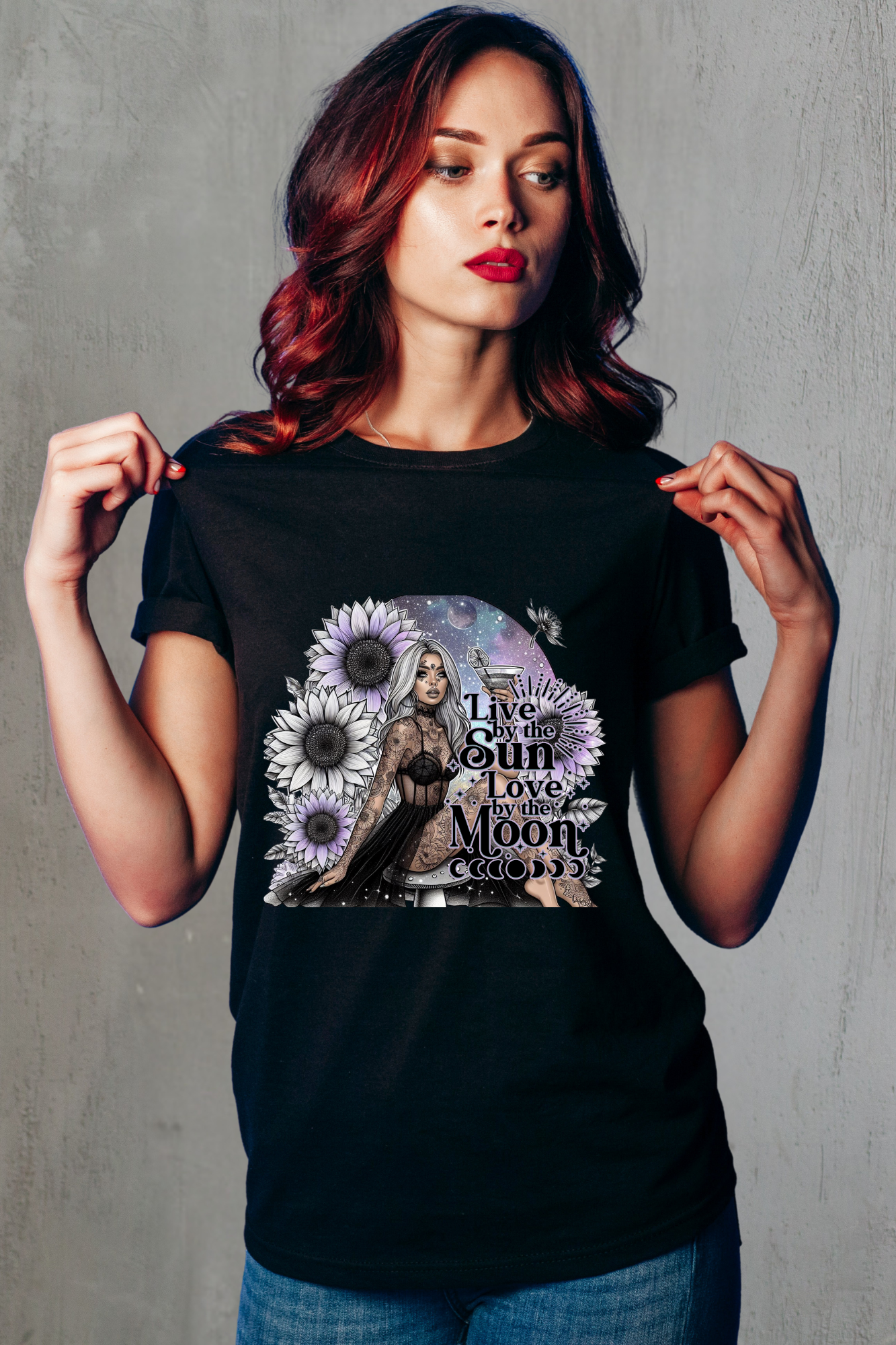 Woman wearing a black t-shirt with a graphic design on a gray background