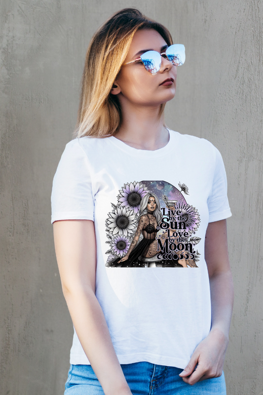 Woman wearing a white t-shirt with a graphic design against a plain background