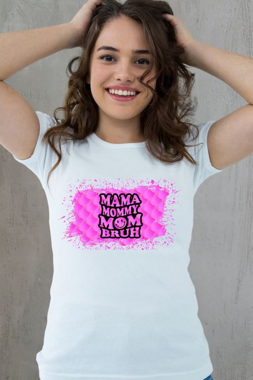 Woman wearing a white t-shirt with a colorful graphic design on a plain background