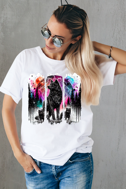 Woman wearing a white t-shirt with a colorful wolf graphic design against a majestic background