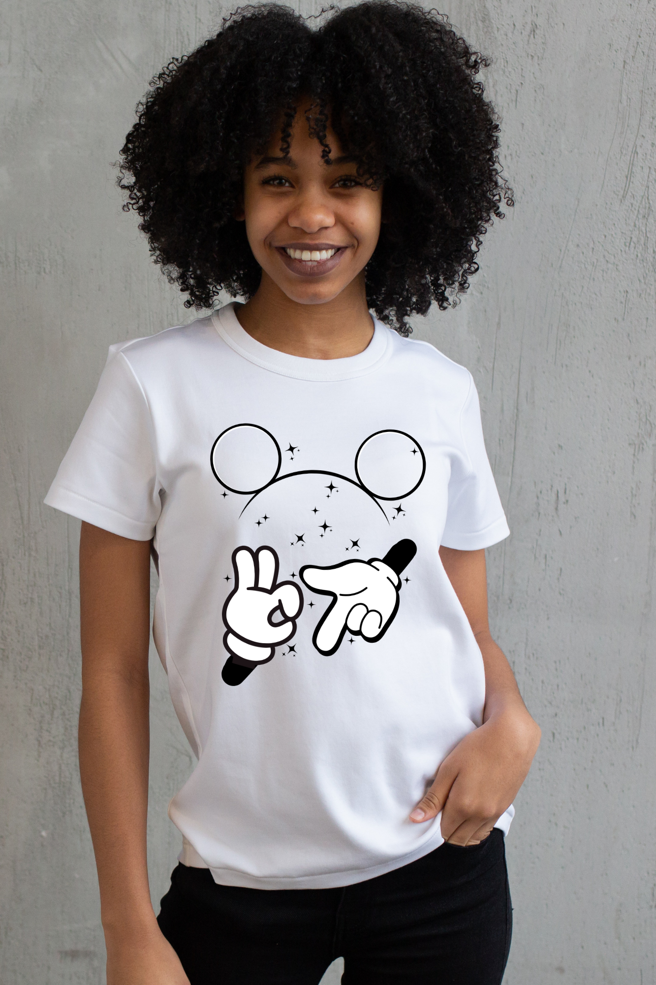 Person wearing a white 67 t-shirt with a cartoon design against a white background