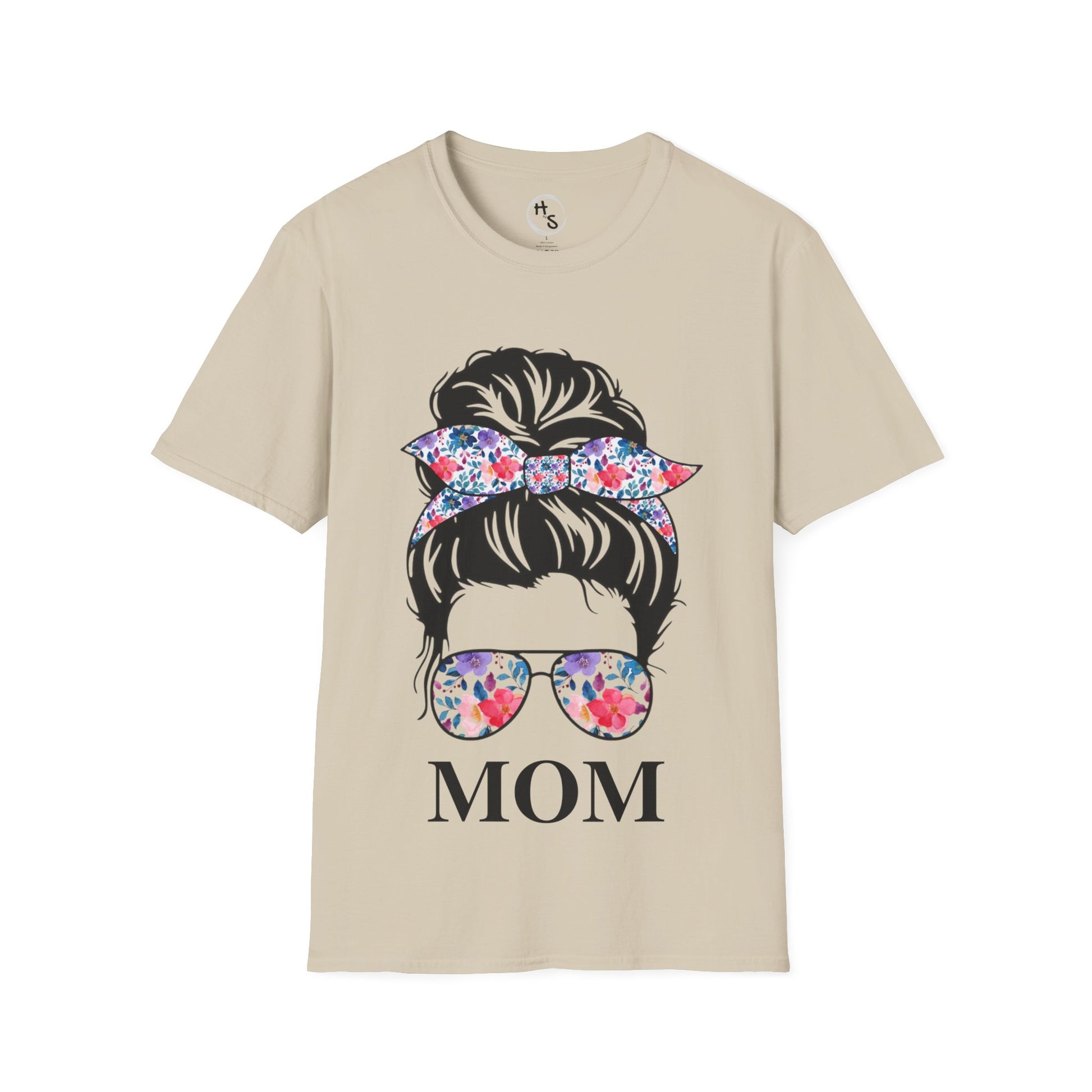 Beige t-shirt with graphic of a woman's head with a floral bow and sunglasses, and the word 'MOM'.