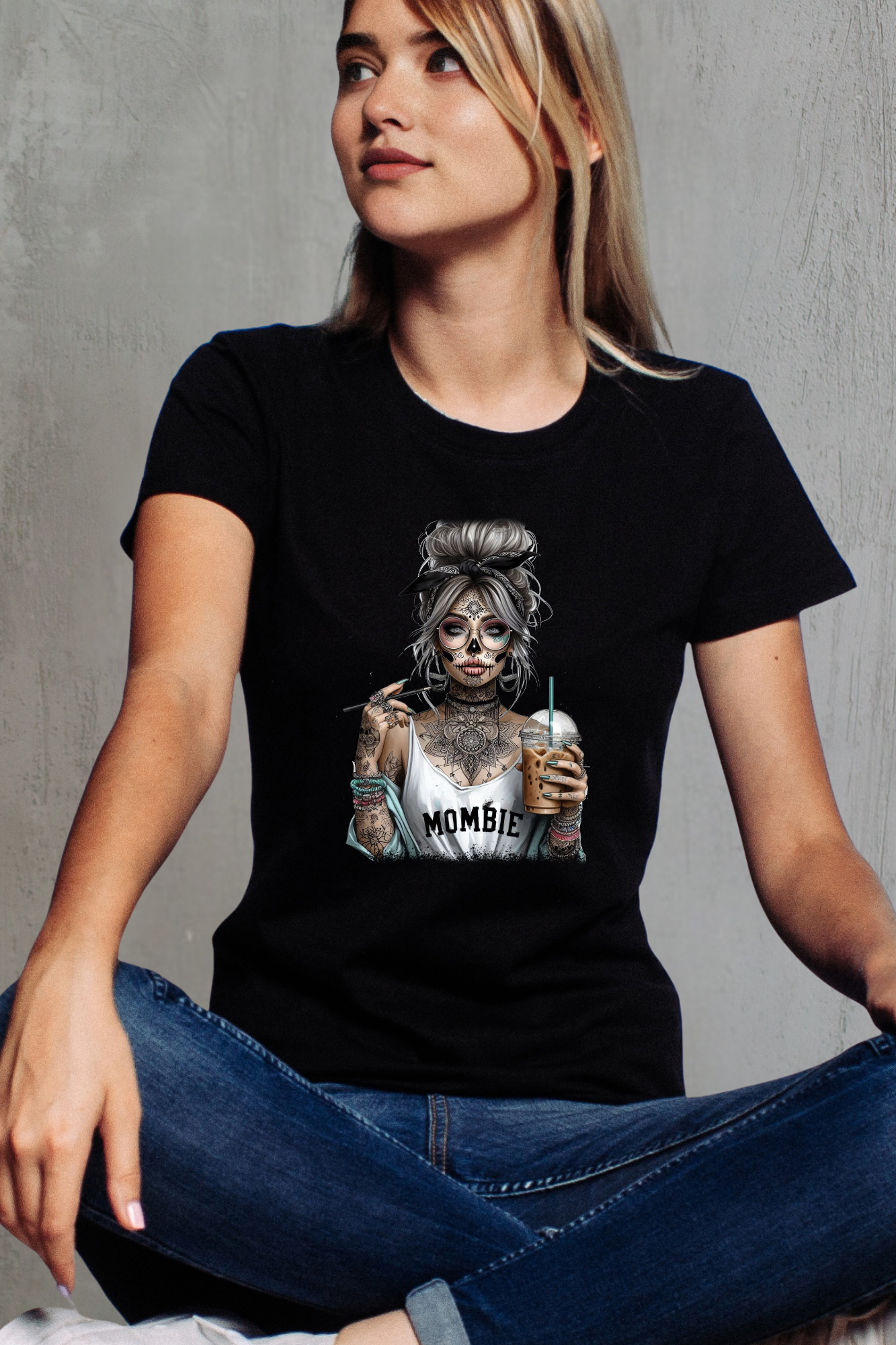 Person wearing a black t-shirt with a graphic design of a woman holding a drink.