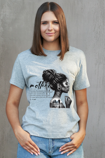 Woman wearing a light blue t-shirt with a graphic design of a woman and text on a gray background