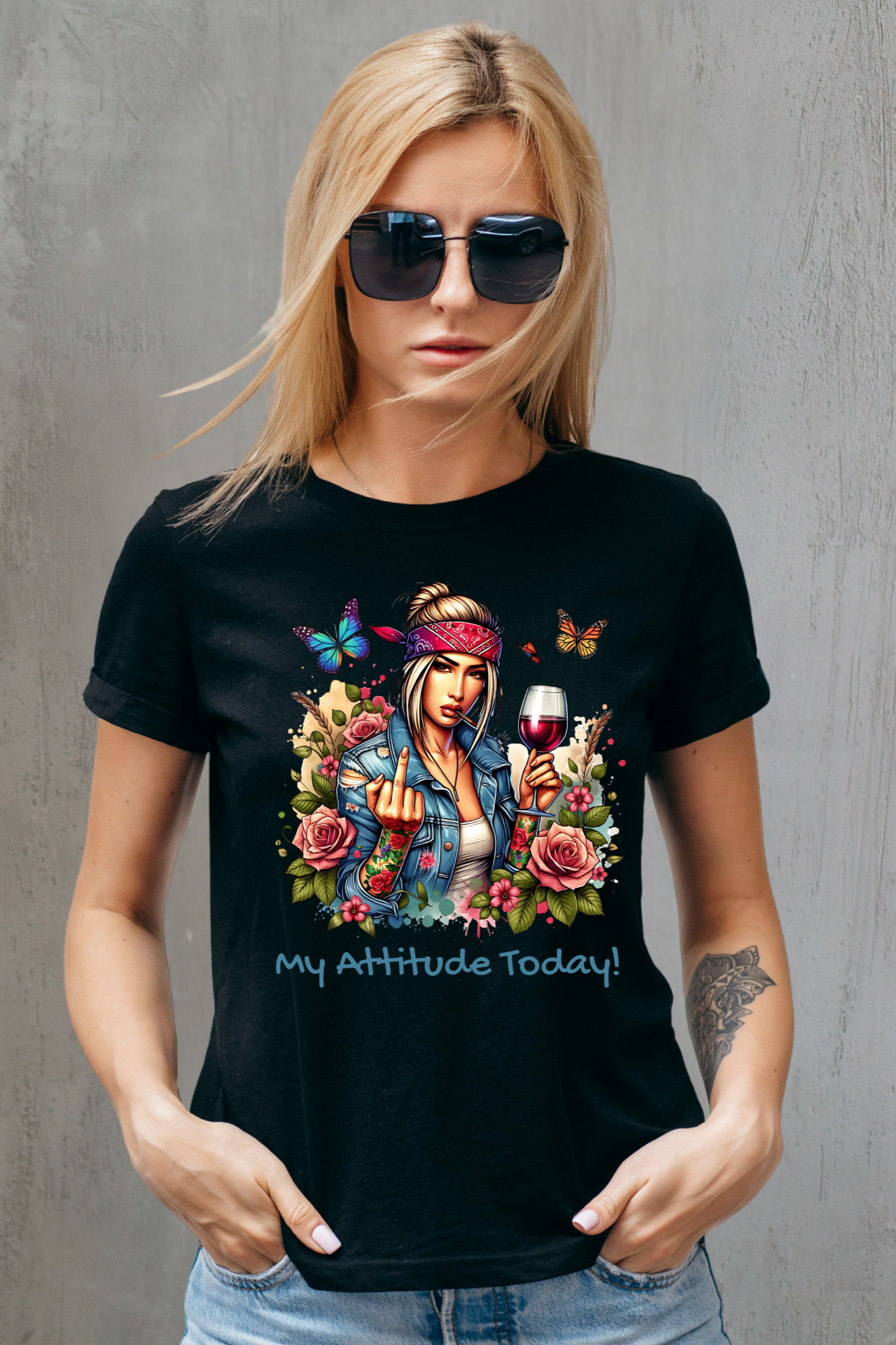 Woman wearing a black t-shirt with a colorful graphic and text against a gray background