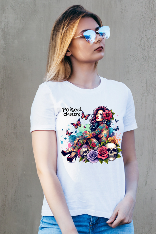Woman wearing a white t-shirt with colorful graphic design and text.