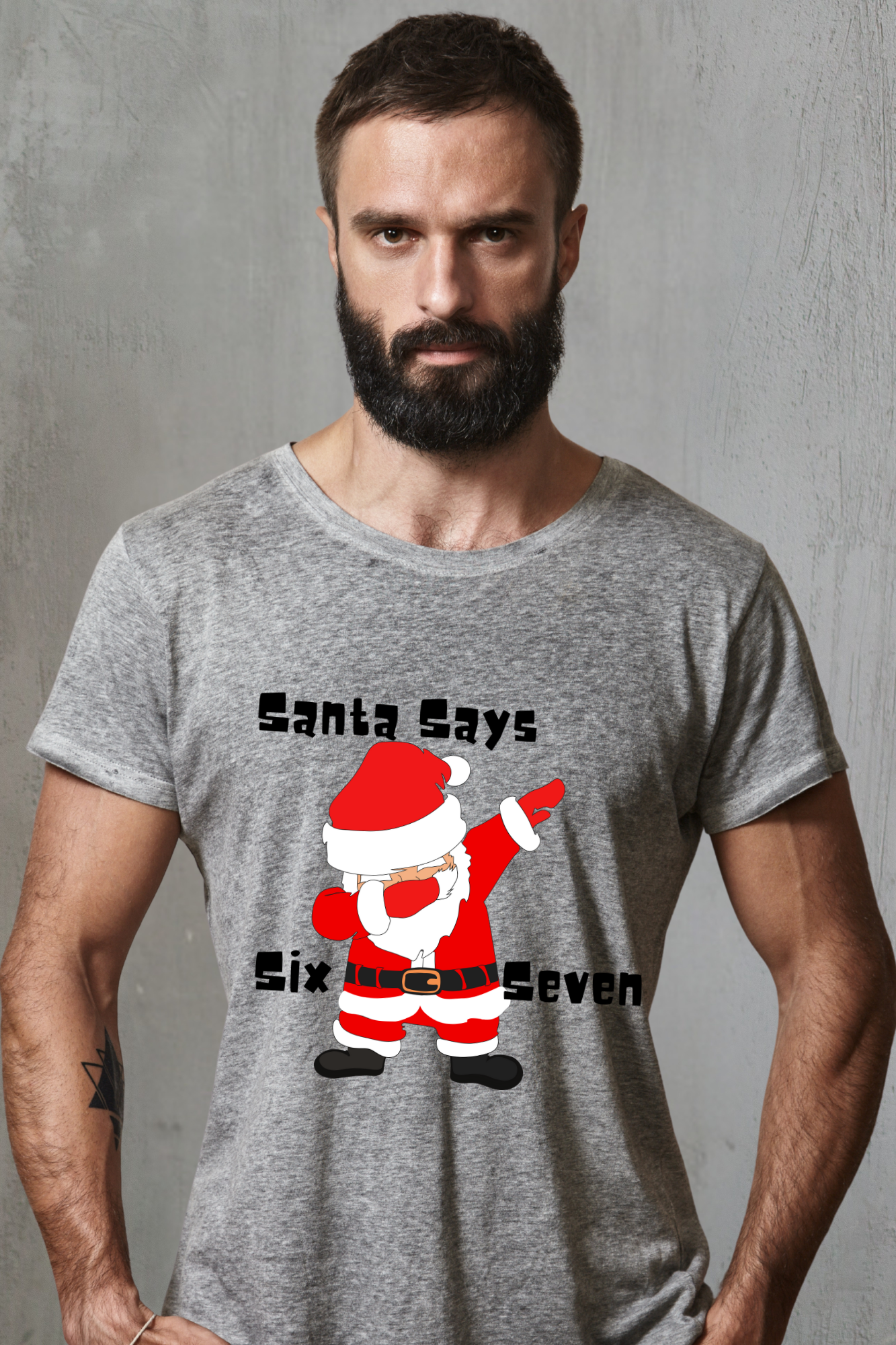 Man wearing a gray t-shirt with a 67 Santa Claus graphic and text against a gray background