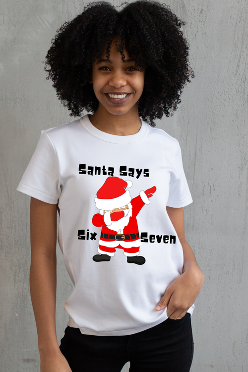 Person wearing a white t-shirt with a graphic of Santa Claus and 67 text, standing against a white background