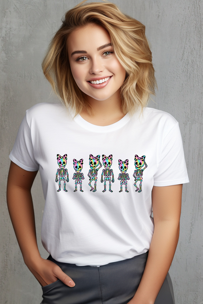 Person wearing a white t-shirt with colorful skeleton illustrations on a white background