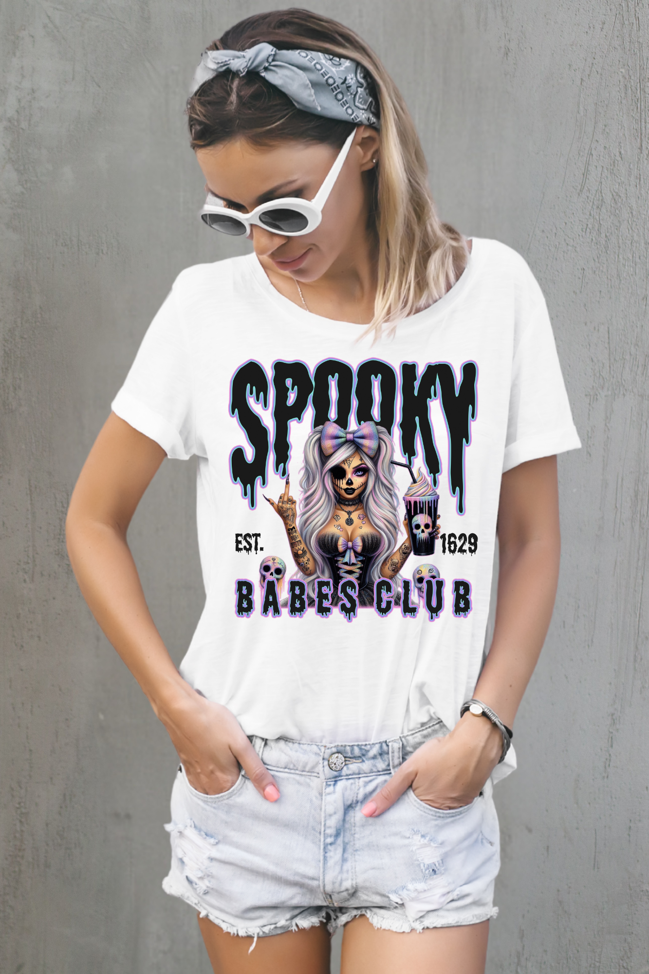 Woman wearing a white t-shirt with 'Spooky Babes Club' design against a white background