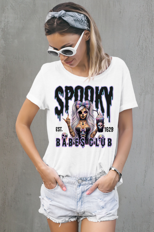 Woman wearing a white t-shirt with 'Spooky Babes Club' design against a white background