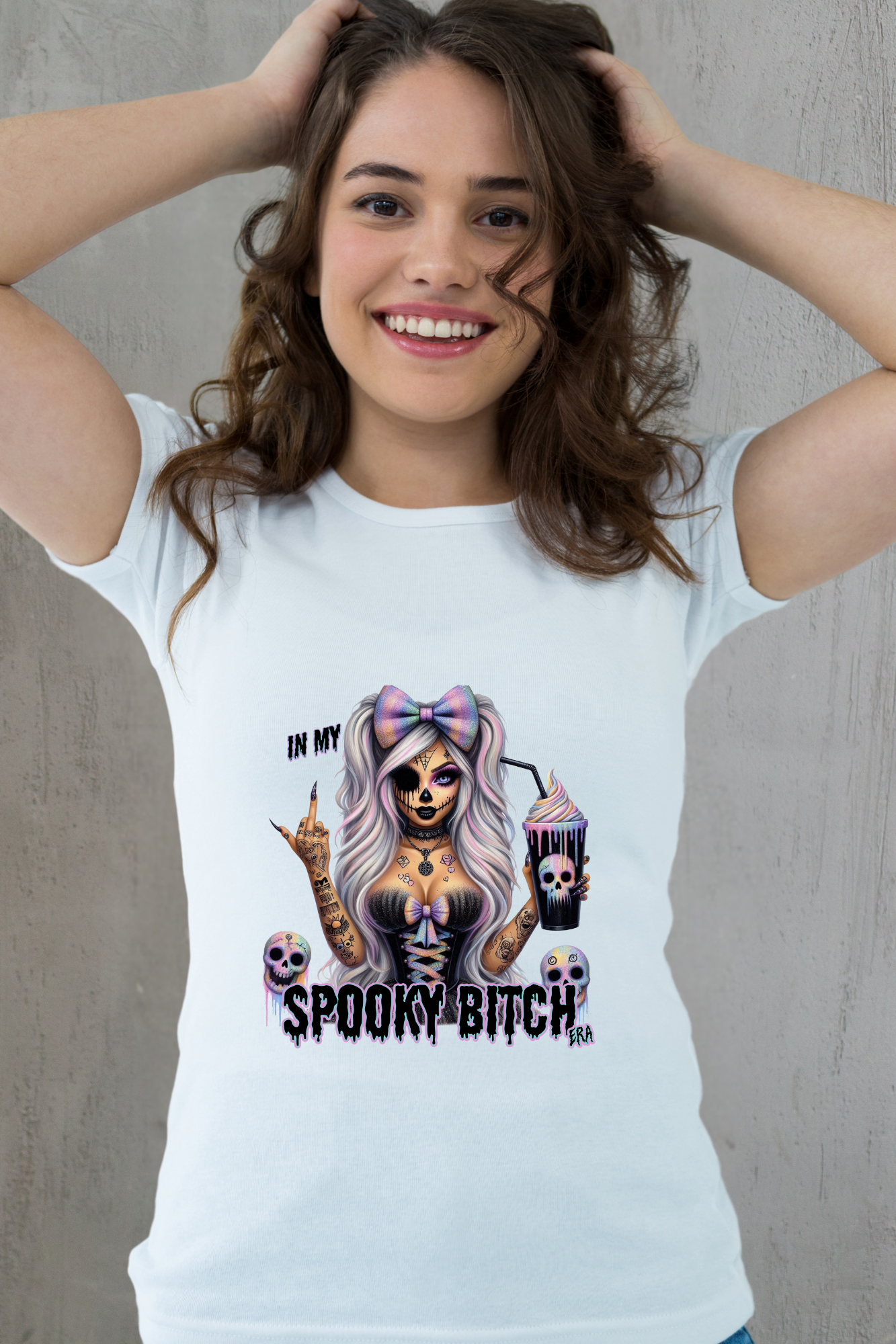 Woman wearing a white t-shirt with a graphic design and text.