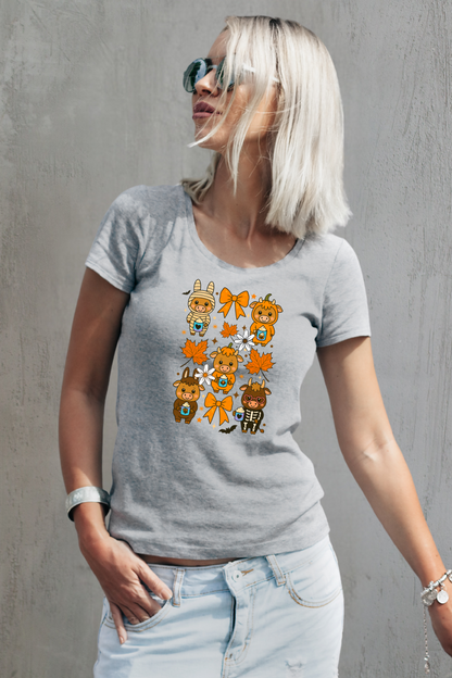 Woman wearing a gray t-shirt with cartoon cow designs against a gray background