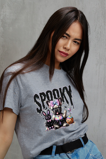 Person wearing a gray t-shirt with cartoon characters and 'SPOOKY' text against a grey background