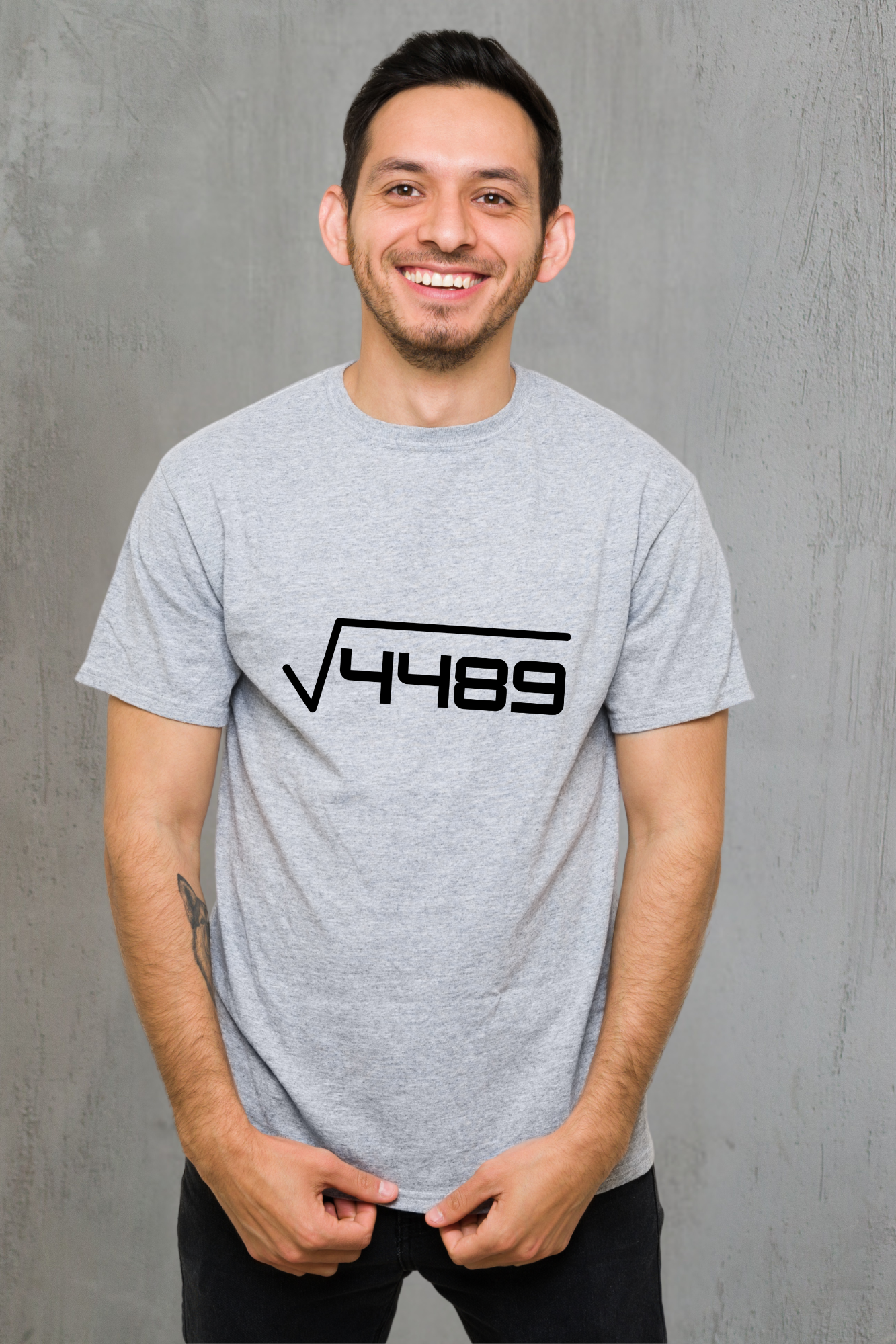 Man wearing a gray t-shirt with a black 67 design on a gray background