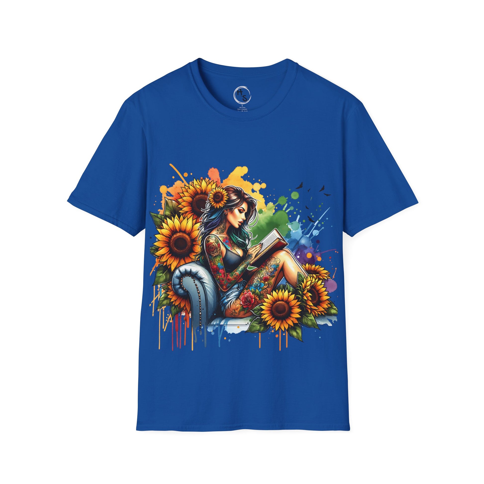 Blue t-shirt with a colorful graphic of a woman reading a book surrounded by sunflowers on a blue background.