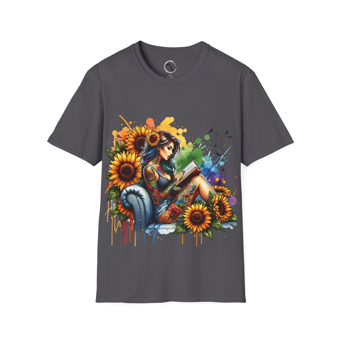 Gray t-shirt with a colorful graphic of a woman reading a book surrounded by sunflowers on a dqark grey background.