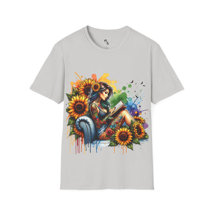 Gray t-shirt with a colorful graphic of a woman reading a book surrounded by sunflowers on a grey background.
