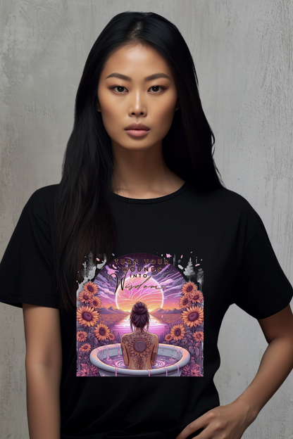 Person wearing a black t-shirt with a colorful graphic design of a woman in a bath tub with flowers.