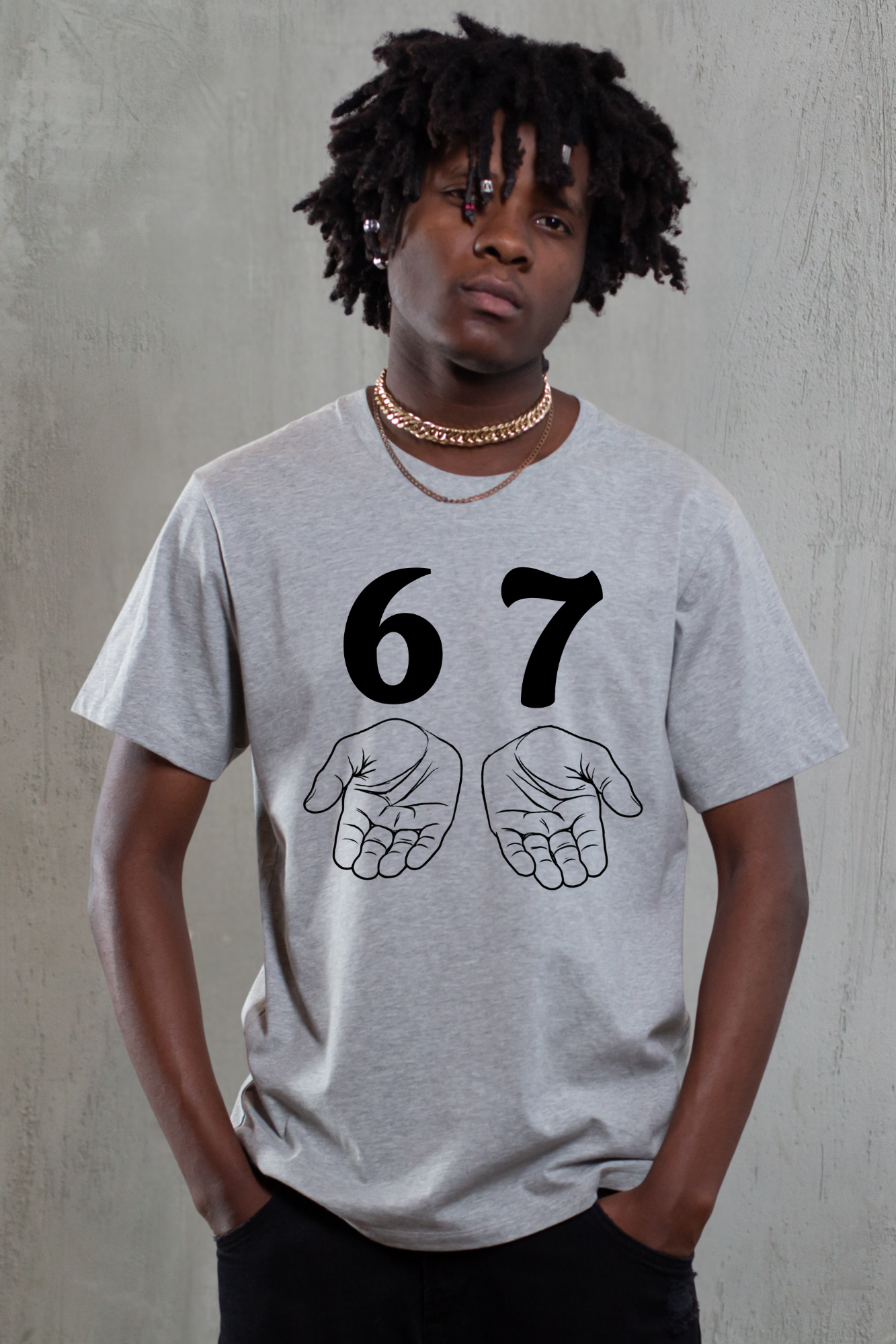 Person wearing a gray t-shirt with '67' and hand gestures on a plain background