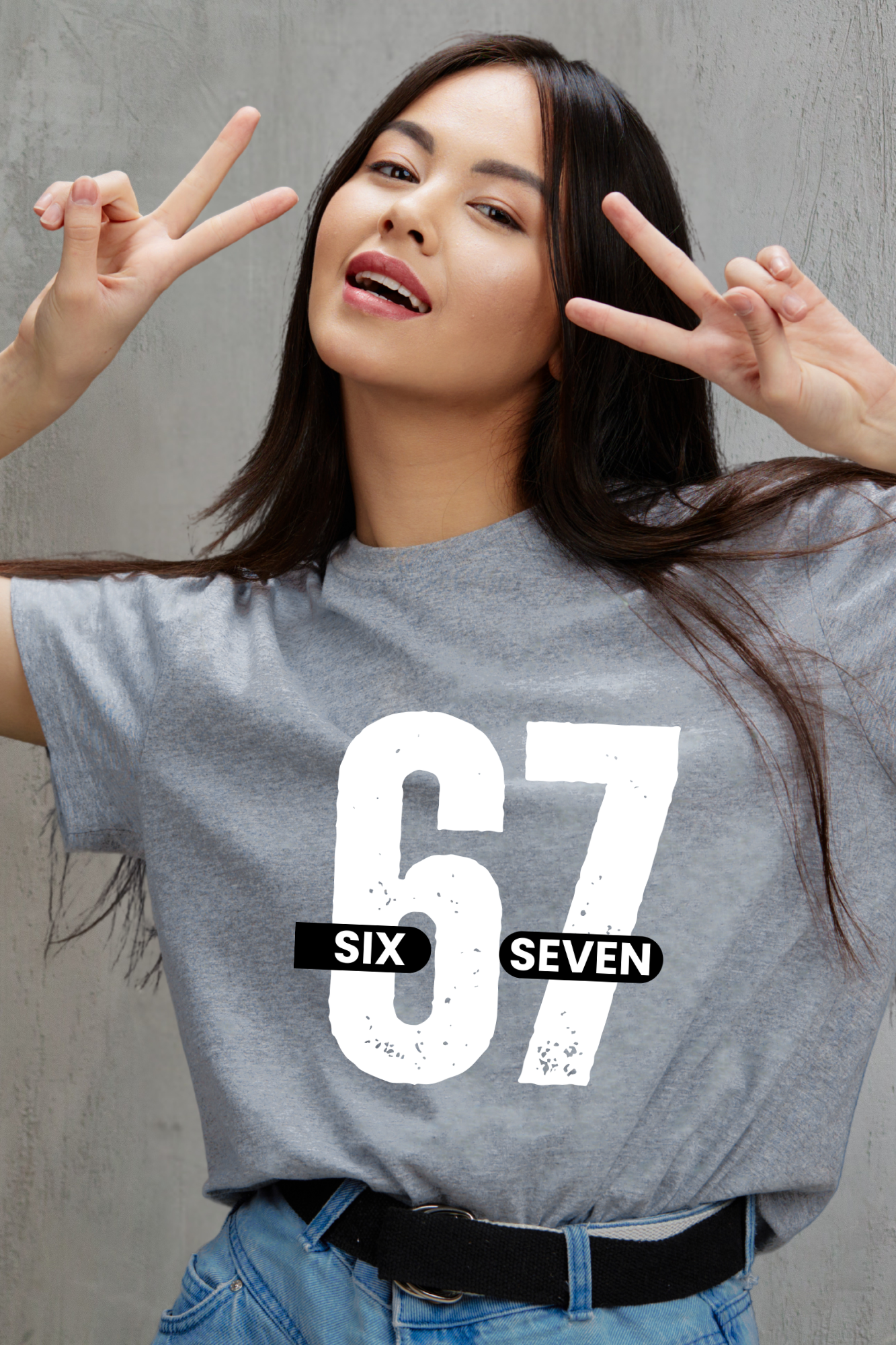Woman wearing a gray t-shirt with '67 Six Seven' design, making peace signs.