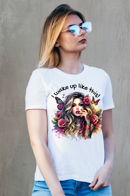 Woman wearing a white t-shirt with a colorful graphic and text against a plain background