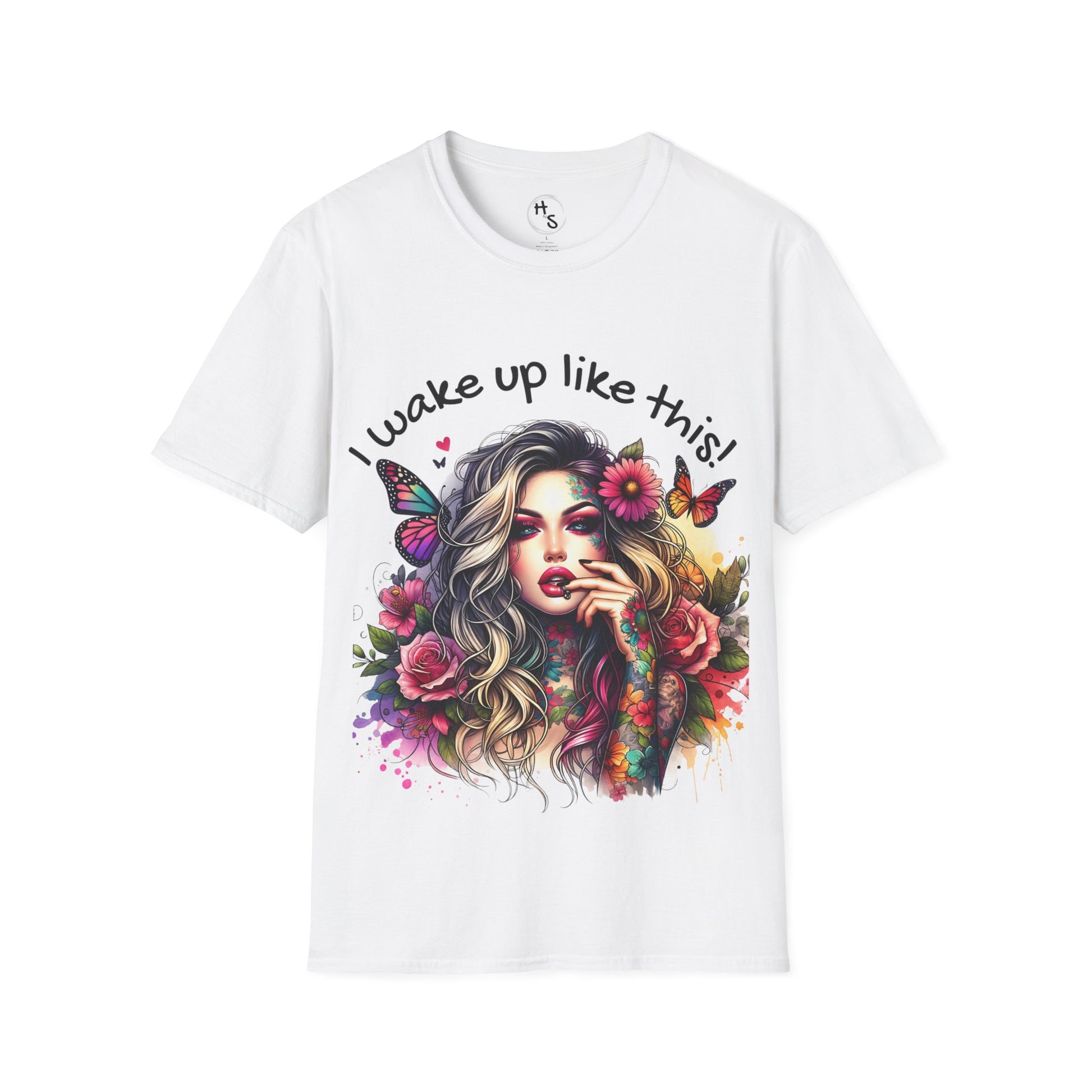 White t-shirt with a colorful design of a woman with flowers and butterflies, and text 'I wake up like this!' on a white background.